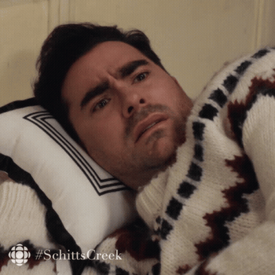 Man In Sweater Lying On Pillow Schitts Creek GIF