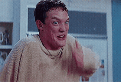 Man In Sweater Making Funny Face GIF