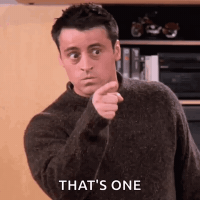 Man In Sweater Pointing At Camera GIF