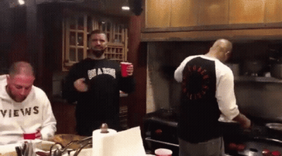 Man In Sweater Saying Views In Kitchen GIF