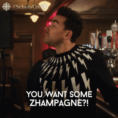 Man In Sweater Saying You Want Champagne GIF