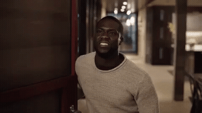 Man In Sweater Standing In Doorway GIF