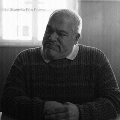 Man In Sweater With Folded Hands At La Guarimba GIF
