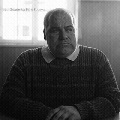 Man In Sweater With La Guarimba Film Festival Watermark GIF