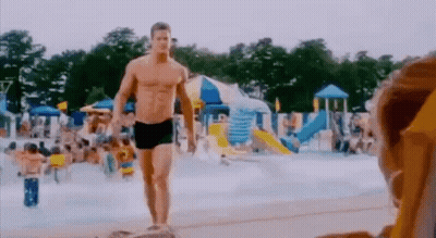 Man In Swim Trunks Walking Water Park GIF