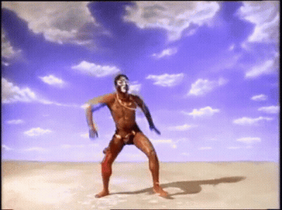 Man In Swimsuit Dancing In Desert GIF