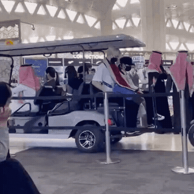 Man In T-Mobile Jacket Talks To Soccer Player GIF