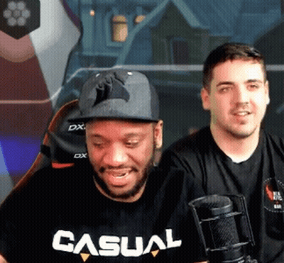 Man In T-Shirt Beside Man In Hat GIF