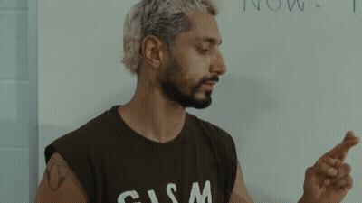 Man In T-Shirt Crosses Fingers GIF