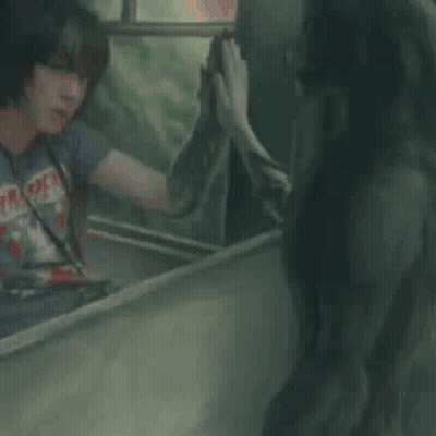 Man In T-Shirt Looking In Mirror GIF