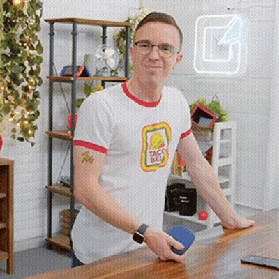 Man In Taco Bell T-Shirt Standing At Table GIF