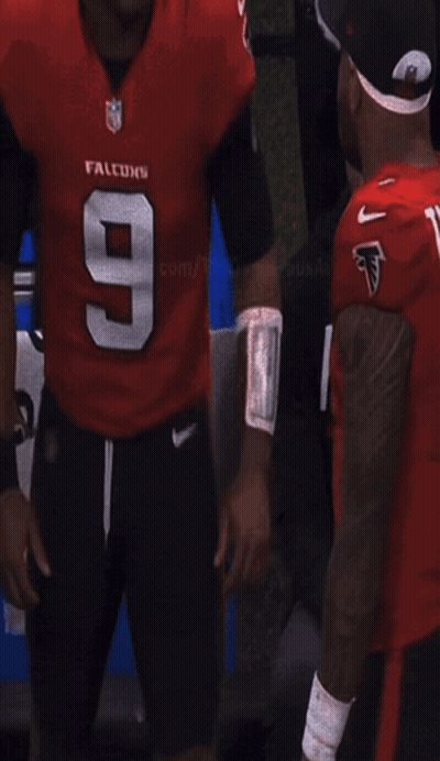 Man In Tagovailoa Jersey Escorted By Woman With Gatorade GIF