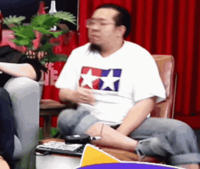 Man In Tamiya T-Shirt Sitting In Chair GIF