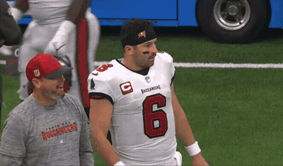 Man In Tampa Bay Buccaneers Shirt Next To Football Player GIF