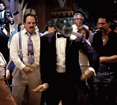 Man In Tan Coat And Black Sweater Making Face GIF