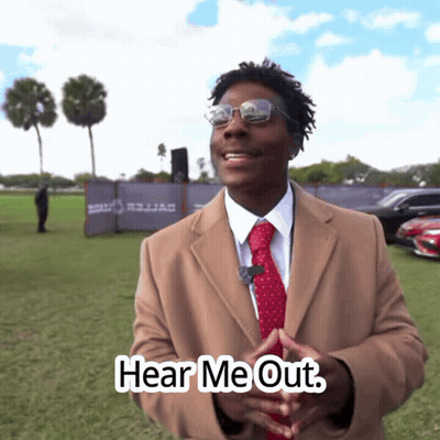 Man In Tan Coat And Red Tie Says Hear Me Out GIF