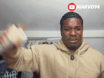 Man In Tan Hoodie Holding Coffee GIF