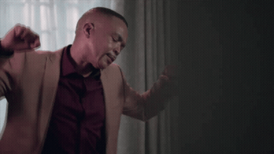 Man In Tan Jacket And Red Shirt Dancing GIF