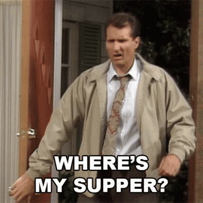 Man In Tan Jacket And Tie Asking Where's My Supper GIF
