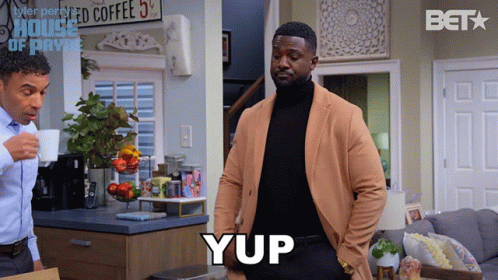 Man In Tan Jacket Says Yup In Front Of House Of Payne GIF