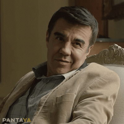 Man In Tan Jacket Sitting In Chair With Pantaya GIF