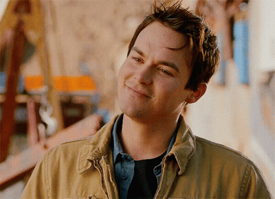 Man In Tan Jacket Smiling Looking To Side GIF