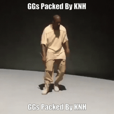 Man In Tan Shirt And Khaki Pants Dancing GIF