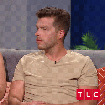 Man In Tan Shirt On Couch With TLC GIF