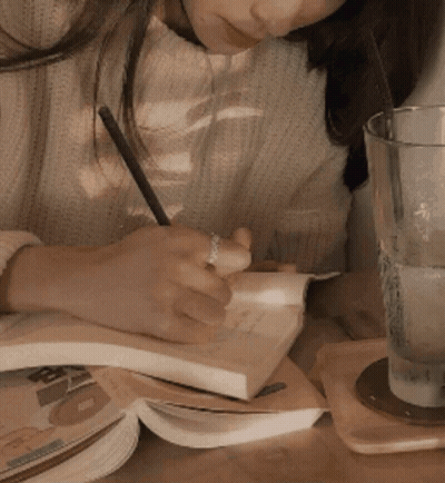 Man In Tan Suit And Tie With Hands In Pockets GIF