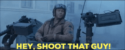 Man In Tank Saying Hey Shoot That Guy Behind Him GIF