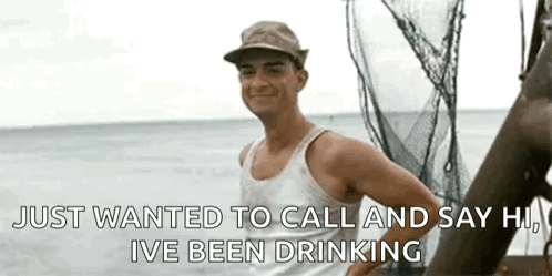 Man In Tank Top And Hat On Boat GIF