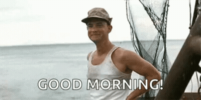 Man In Tank Top And Hat Saying Good Morning On Boat GIF