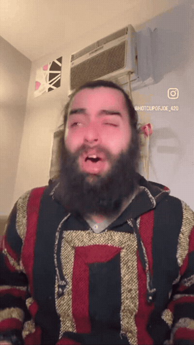Man In Tank Top And Shorts Crosses Arms GIF