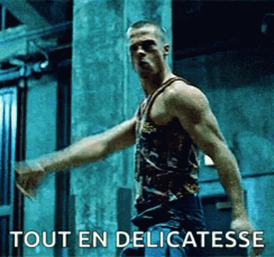 Man In Tank Top Arms Outstretched Says Tout En Delicatesse GIF
