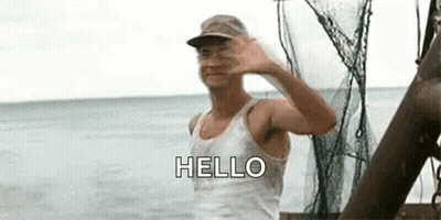 Man In Tank Top Hat Waving On Boat GIF