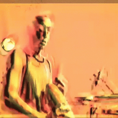 Man In Tank Top Playing Drums GIF