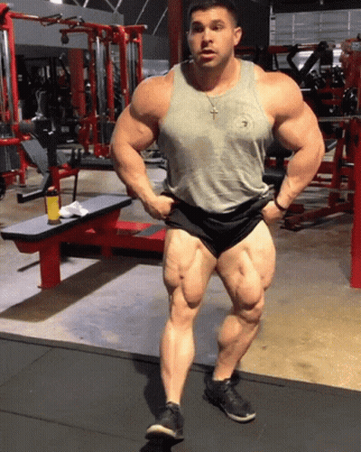 Man In Tank Top Shorts Hands On Hips GIF