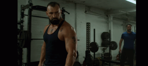 Man In Tank Top With 'A' Tattoo GIF