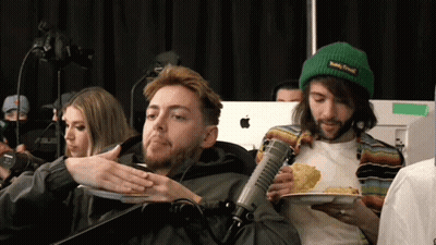 Man In Teddy Bear Sweater In Front Of Off The Rails Whiteboard GIF