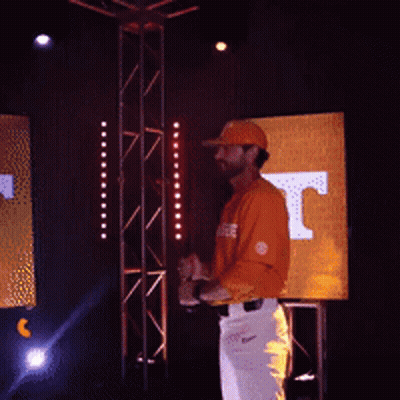 Man In Tennessee Shirt Holding Hat Up GIF