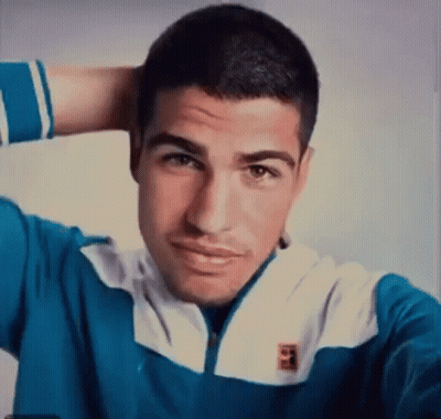 Man In Tennis Uniform Making Funny Face To Crowd GIF