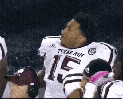 Man In Texas A&M Football Jersey With Teammates GIF