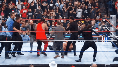Man In Texas A&M Shirt Standing In Wrestling Ring GIF