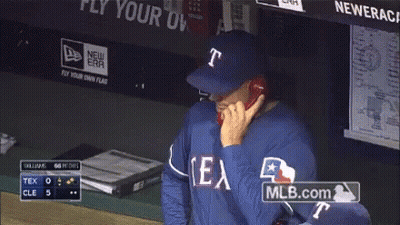 Man In Texas Jersey Talking On Phone GIF