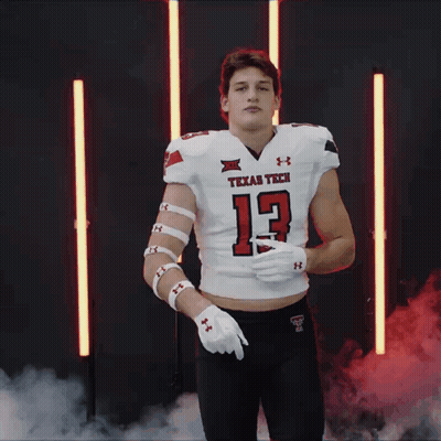 Man In Texas Tech Football Jersey Pointing GIF