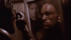 Man In The Mirror Combing Hair GIF