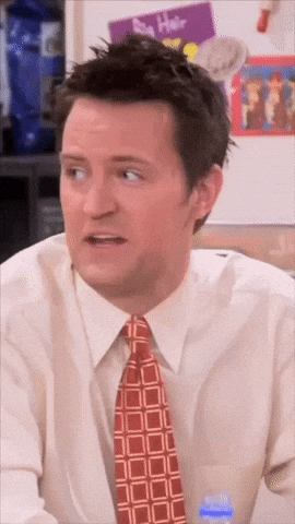 Man In Tie And White Shirt Looks Surprised GIF