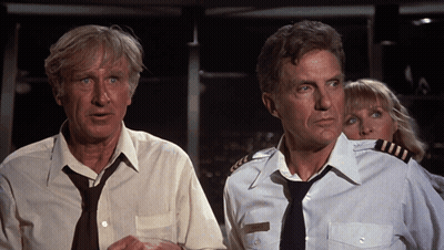 Man In Tie And Woman In Captain Uniform Standing Together GIF