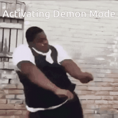 Man In Tie Dancing In Front Of Brick Wall GIF