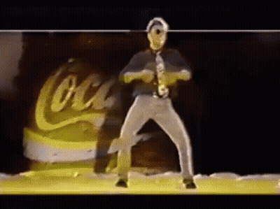 Man In Tie Dancing In Front Of Coca Cola Can GIF